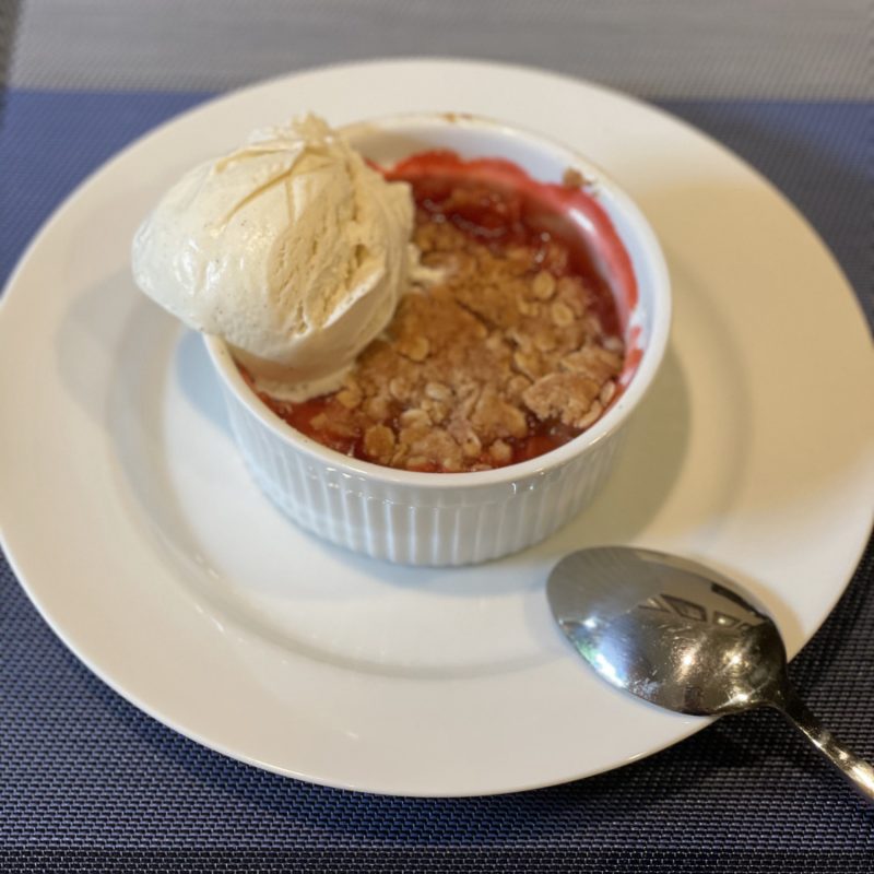 Strawberry rhubarb crisp with vanilla ice cream